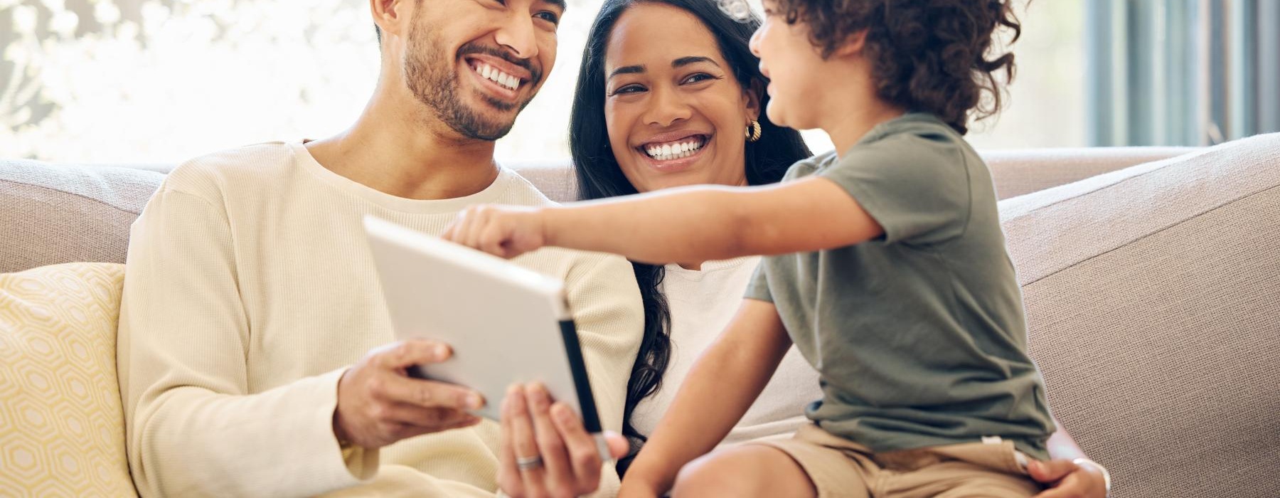a family sitting on a couch