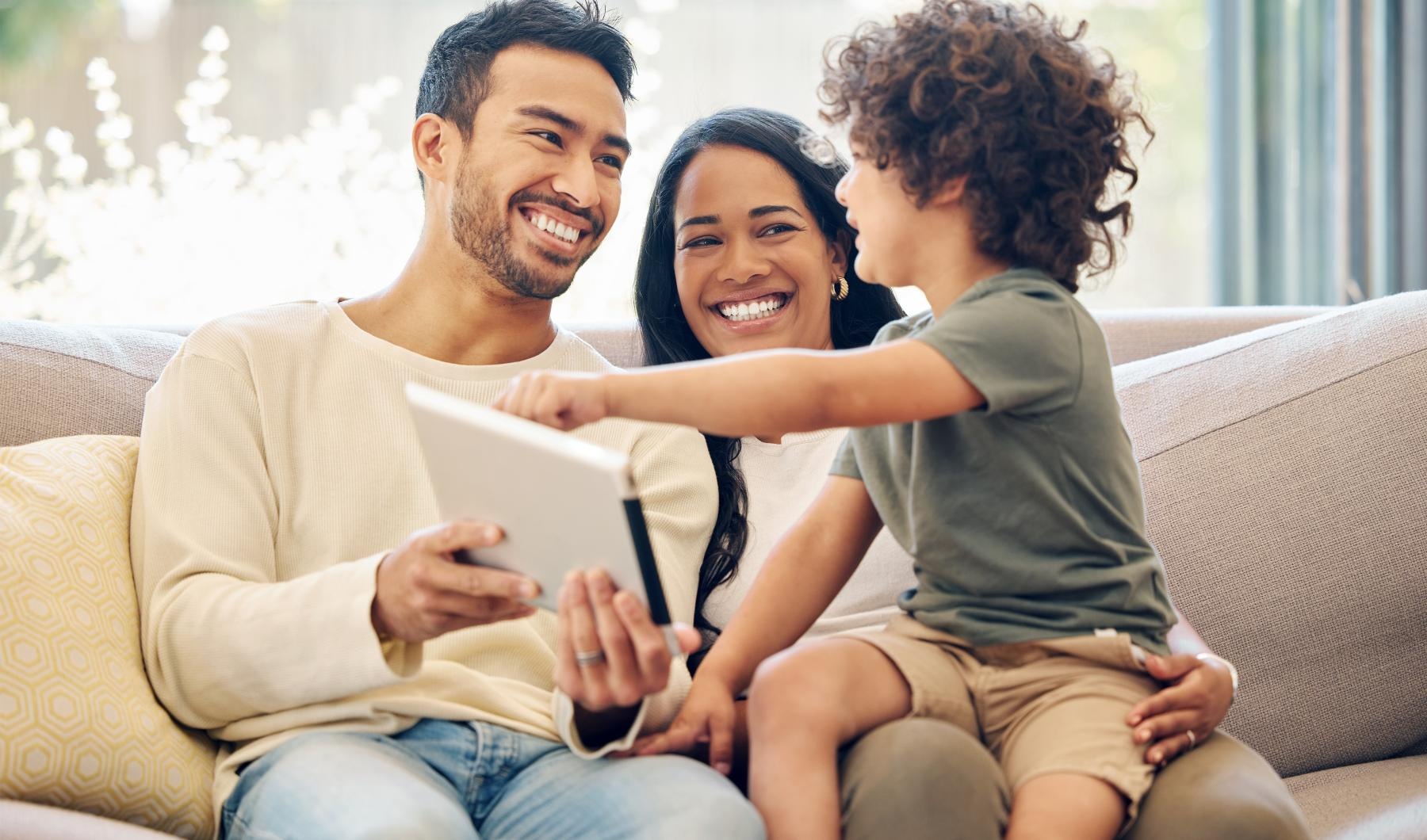 a family sitting on a couch